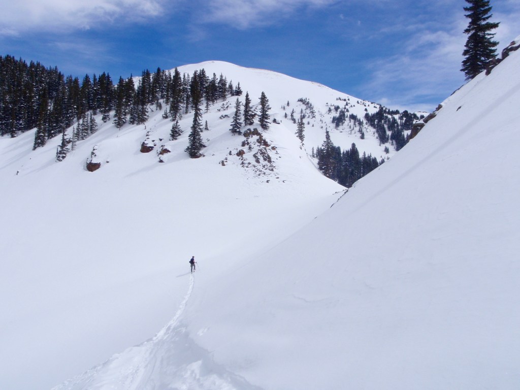 Tyler and I continue out alone through a bit of avy terrain...