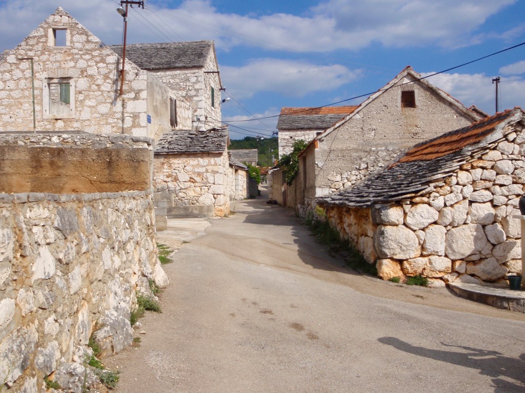 Quiet streets and the ubiquitous white stones in one of many small villages we passed.