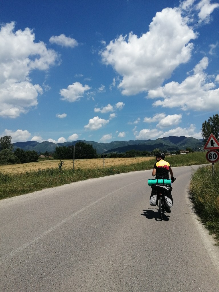 Bike tourist in Tuscany on a sunny day.