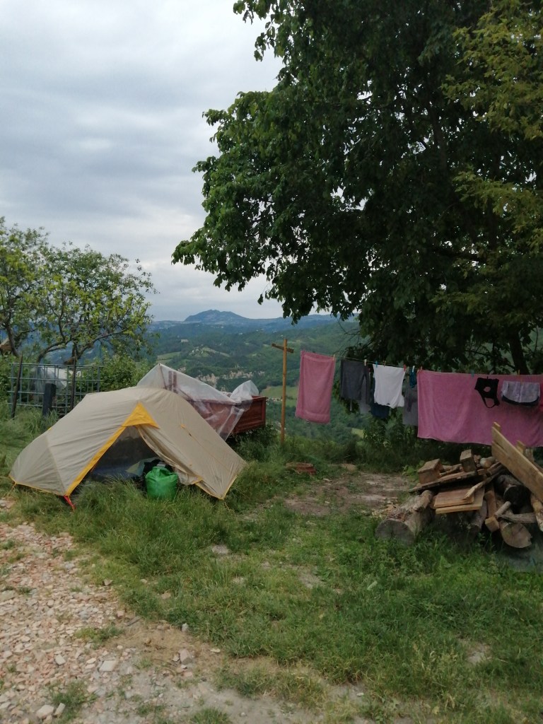 A small tent with a view of the moutnains behind it.